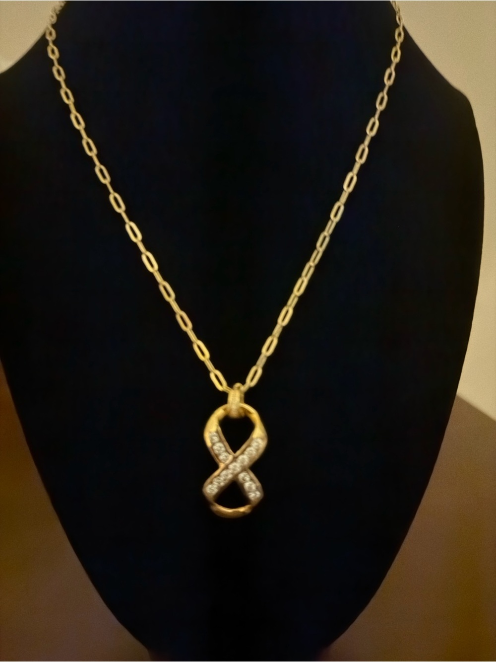 14 k Gold plated Infinity pendant (over solid 925) on a gold plated necklace.